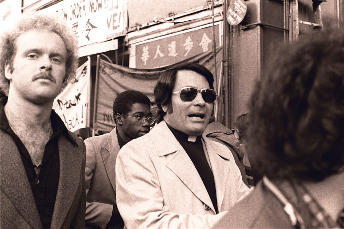 Black and white photograph of Jim Jones in San Francisco Chinatown